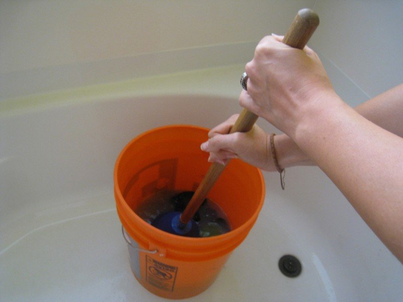 Hand Washing Laundry in a Bucket